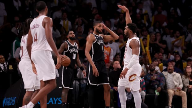 Oct 25, 2023; Brooklyn, New York, USA; Cleveland Cavaliers guard Donovan Mitchell (45) celebrates his game winning three point shot in front of Brooklyn Nets forward Mikal Bridges (1) during the fourth quarter at Barclays Center. Mandatory Credit: Brad Penner-USA TODAY Sports